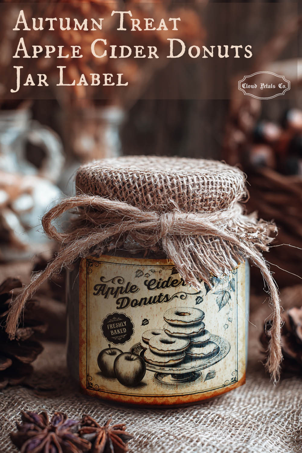 Jar labeled 'Apple Cider Donuts' with burlap ribbon, surrounded by autumn-themed elements.