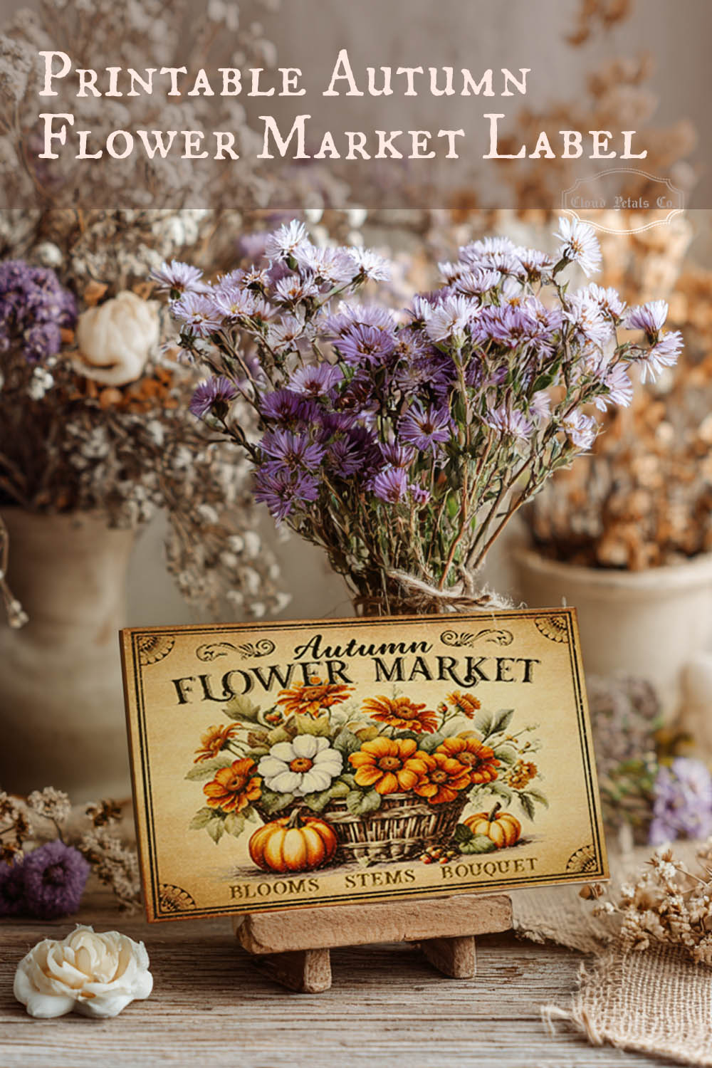 Autumn flower market label with flowers and pumpkins on a wooden stand.