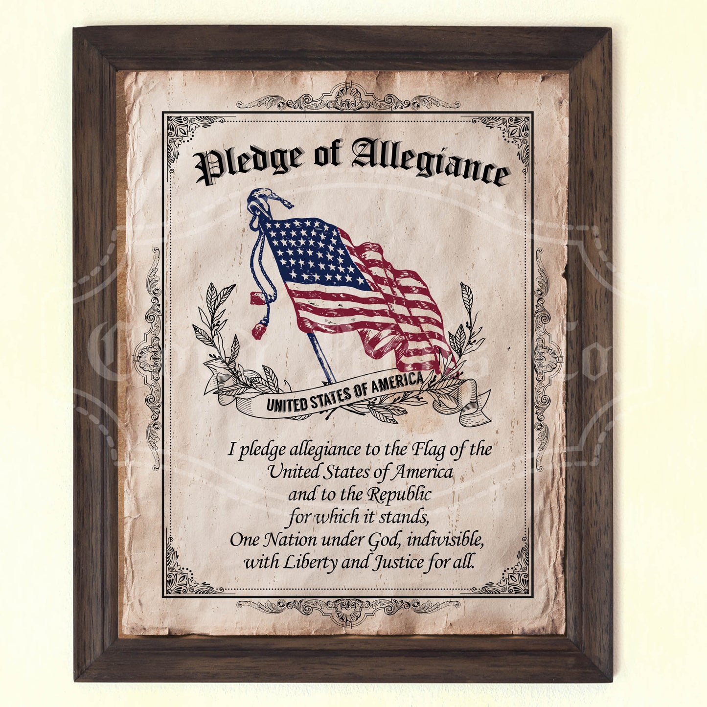 A vintage style wall art featuring the Pledge of Allegiance to the flag of the United States of America, with a flag depicted in the background. The art is bordered with a floral pattern and has a rustic wooden frame.