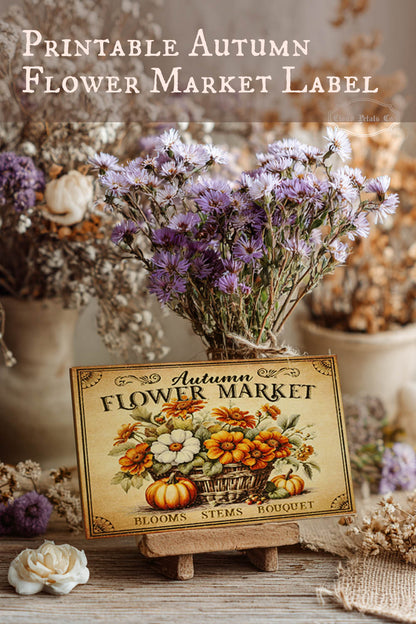 Autumn flower market label with flowers and pumpkins on a wooden stand.