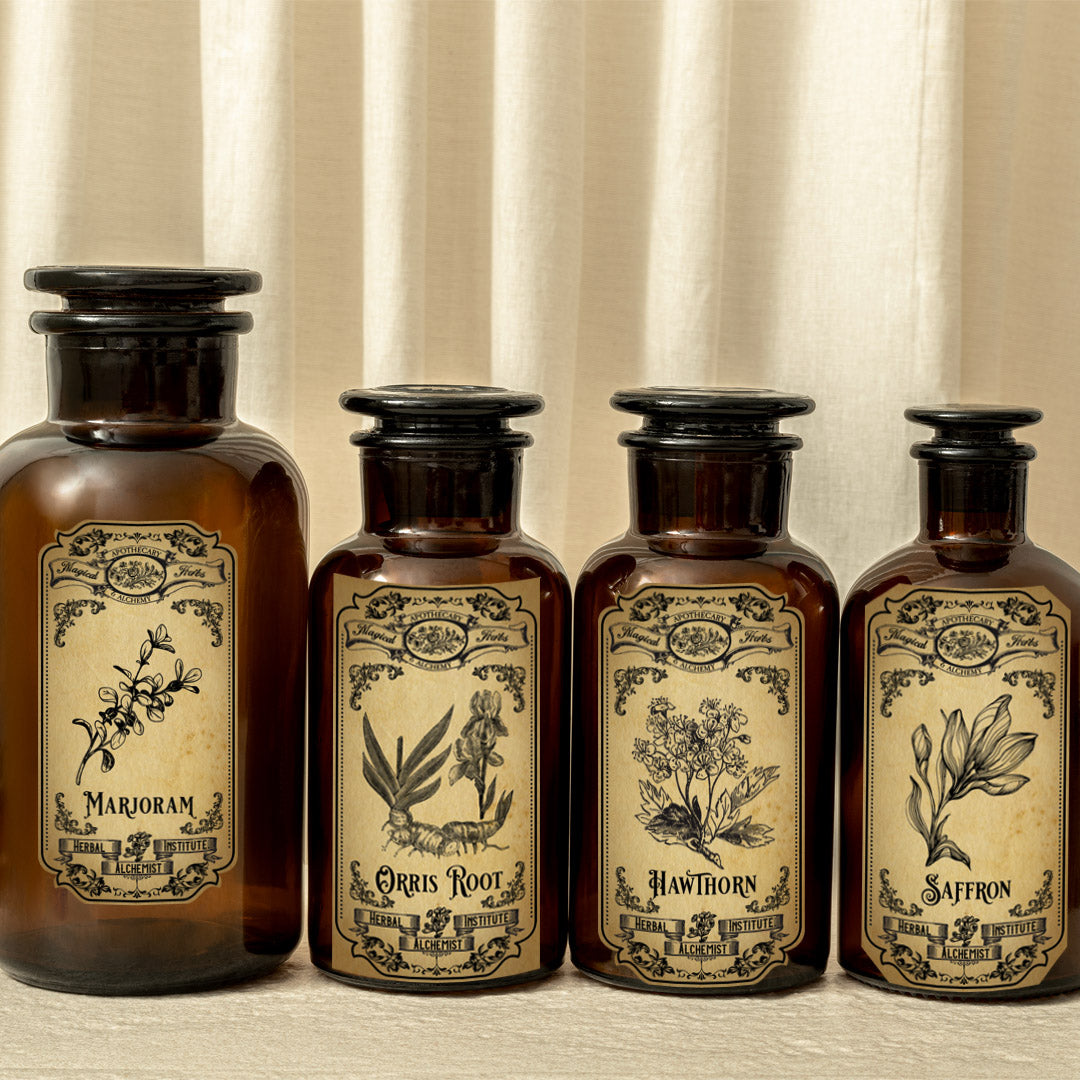Four brown bottles with vintage-style labels featuring botanical illustrations and text.